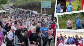 Bupati Kerinci Monadi berjalan bersama masyarakat saat Car Free Day perdana di Jalur Dua Bukit Tengah, Minggu (7/9/2025).