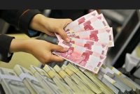 Ilustrasi uang rupiah dan dolar AS