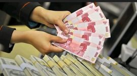 Ilustrasi uang rupiah dan dolar AS