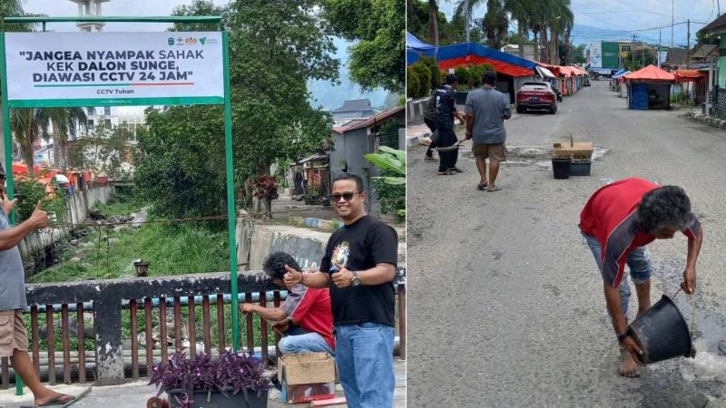 Lurah Sungai Penuh, Wiwin Septiadi, saat memasang papan larangan membuang sampah di kawasan Sungai Bungkal.