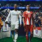 Pemain Real Madrid dan Bayern Munich bersiap memasuki lapangan di tengah sorakan suporter pada pertandingan UEFA Champions League.