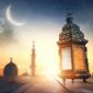 Ilustrasi suasana menyambut Ramadan dengan siluet masjid dan hilal di langit senja.
