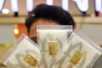 Ilustrasi emas batangan Antam yang mengalami penurunan harga.