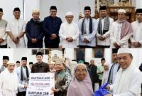 Al Haris dan Monadi menyerahkan bantuan di Masjid Al-Falah.