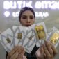 Pegadaian menurunkan harga emas Antam pada Kamis, 23 April 2026, dengan harga 1 gram Rp2.944.000.