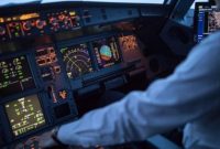 Ilustrasi pilot di kokpit pesawat. (iStockphoto/ViktorCap)