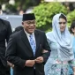 Mohammad Jumhur Hidayat menuju pelantikan di Istana Negara, Jakarta.
