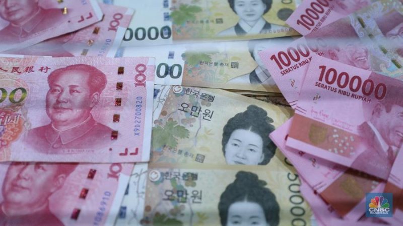 Ilustrasi layar perdagangan yang menampilkan nilai tukar mata uang Asia terhadap dolar AS.