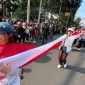 Ratusan anak muda mengarak bendera Merah Putih sepanjang 100 meter dalam Karnaval Paskah Semarang 2026 sebagai simbol persatuan dan kebhinekaan.