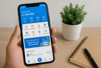 Ilustrasi Smartphone menampilkan aplikasi saldo digital di atas meja kerja.