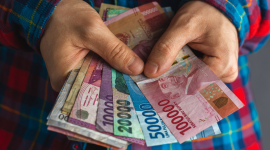 Ilustrasi transaksi Local Currency Transaction (LCT) yang digunakan Indonesia dalam perdagangan internasional tanpa melalui dollar AS. (Fhoto : Shutterstock/Travis182)