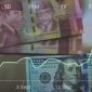 Ilustrasi pergerakan kurs dolar AS yang menguat terhadap rupiah di pasar valuta asing.(Ilustrasi/Foto: Andhika Prasetia)