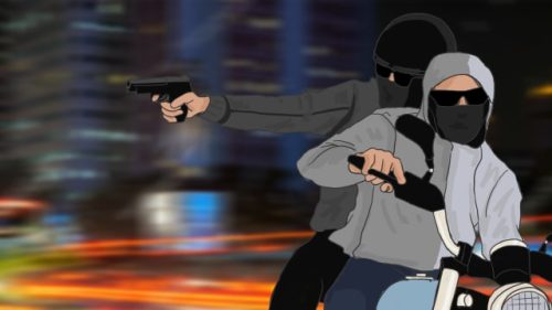 Ilustrasi pelaku begal menyerang pengendara motor pada malam hari