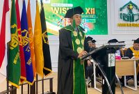Rektor IAIN Kerinci, Dr. Jafar Ahmad, menyampaikan sambutan pada Wisuda Sarjana dan Pascasarjana Angkatan XII, Kamis (18/6/2026).