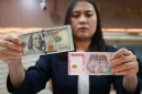 Ilustrasi pergerakan nilai tukar rupiah terhadap dolar AS ( Foto Tribune wa.com)
