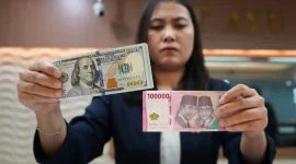 Ilustrasi pergerakan nilai tukar rupiah terhadap dolar AS ( Foto Tribune wa.com)