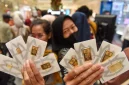 Ilustrasi emas batangan Antam dengan harga terbaru yang mengalami kenaikan pada perdagangan Jumat pagi.( FOTO : Indrianto Eko Suwarso/wpa/am. )