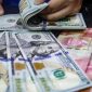 Gubernur Bank Indonesia Perry Warjiyo menyampaikan kebijakan terbaru pembatasan pembelian dolar AS dalam konferensi pers Rapat Dewan Gubernur, Jakarta, Kamis (18/6/2026).(Foto: Andhika Prasetia/detikFoto)