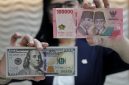 Pergerakan nilai tukar rupiah terhadap dolar AS yang melemah memicu minat masyarakat pada investasi valas.(Foto : CNN Indonesia/Safir Makki).
