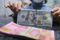 Pergerakan rupiah menguat terhadap dolar AS pada perdagangan terbaru didorong kebijakan Bank Indonesia dan pelemahan dolar global ( Foto : CNBC Indonesia/Faisal Rahman)