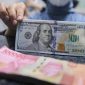 Pergerakan rupiah menguat terhadap dolar AS pada perdagangan terbaru didorong kebijakan Bank Indonesia dan pelemahan dolar global ( Foto : CNBC Indonesia/Faisal Rahman)