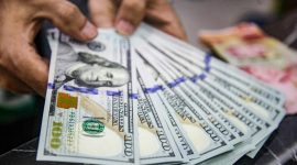 Nilai tukar dolar AS menguat terhadap rupiah usai pengunduran diri Gubernur Bank Indonesia Perry Warjiyo.(Foto: Andhika Prasetia/detikFoto)
