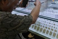 Ilustrasi emas batangan Antam. Harga emas Antam naik Rp10 ribu menjadi Rp2,62 juta per gram pada perdagangan 27 Juli 2026.(Foto: CNN Indonesia/Safir Makki)