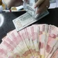 Nilai tukar rupiah menguat terhadap dolar AS pada perdagangan terbaru. ( Foto : Liputan6.com/Angga Yuniar)