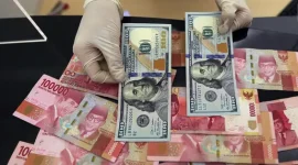 Nilai tukar rupiah menguat tipis terhadap dolar AS pada perdagangan Senin (24/8/2026).(Foto : Liputan6.com/Johan Tallo)