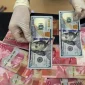 Nilai tukar rupiah menguat tipis terhadap dolar AS pada perdagangan Senin (24/8/2026).(Foto : Liputan6.com/Johan Tallo)