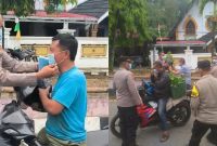 Personel Polres Kerinci dan Polsek Sungai Penuh membagikan masker gratis kepada pengendara, Rabu (26/8/2026).