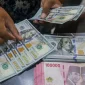 Rupiah diprediksi melemah terhadap dolar AS pada perdagangan Jumat, 14 Agustus 2026.(Foto : Bisnis/Himawan L Nugraha)
