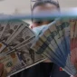 Rupiah kembali melemah terhadap dolar AS pada penutupan perdagangan Senin, 14 September 2026. (Foto : Liputan6.com/Angga Yuniar) 