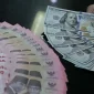 Ilustrasi rupiah dan dolar AS yang menggambarkan pergerakan nilai tukar mata uang.(Foto : The Fed/TRIBUNNEWS/IRWAN RISMAWAN)