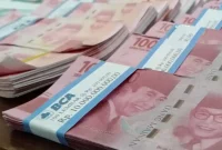 Rupiah masih menghadapi tekanan akibat konflik Iran-AS, harga minyak, dan kebijakan The Fed.(Foto : WARTA KOTA/HENRY LOPULALAN/tribunnews.com)