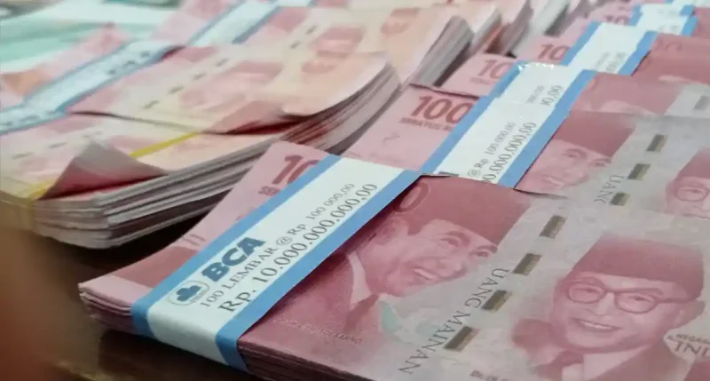 Rupiah masih menghadapi tekanan akibat konflik Iran-AS, harga minyak, dan kebijakan The Fed.(Foto : WARTA KOTA/HENRY LOPULALAN/tribunnews.com)