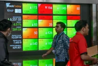 IHSG menguat 4,9% selama perdagangan 19–23 Oktober 2026, dengan TRUK mencatat kenaikan saham tertinggi.(Foto : BAY ISMOYO/AFP)