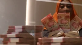 Rupiah menguat ke Rp17.896 per dolar AS pada pembukaan perdagangan Jumat, 9 Oktober 2026.(Foto : Liputan6.com/Angga Yuniar)