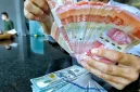 Rupiah melemah terhadap dolar AS di tengah tekanan pasar domestik dan ketegangan geopolitik global.(Foto : Liputan6.com/Angga Yuniar)