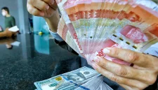 Rupiah melemah terhadap dolar AS di tengah tekanan pasar domestik dan ketegangan geopolitik global.(Foto : Liputan6.com/Angga Yuniar)