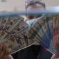 Rupiah menguat ke Rp18.015 per dolar AS pada pembukaan perdagangan Selasa (20/10/2026). (Foto : Liputan6.com/Angga Yuniar)