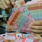 Rupiah melemah ke Rp18.080 per dolar AS pada penutupan perdagangan Jumat (23/10/2026).