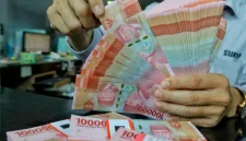 Rupiah melemah ke Rp18.035 per dolar AS seiring tekanan pasar global dan kenaikan harga minyak.(Foto : Liputan6.com/Angga Yuniar)