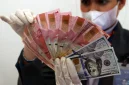 Rupiah menguat ke Rp18.141 per dolar AS pada perdagangan Kamis.(Foto : Liputan6.com/Johan Tallo)