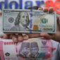 Rupiah melemah ke Rp18.050 per dolar AS di tengah tekanan sentimen global dan domestik.(Foto : CNBC Indonesia/Faizal Rahman)