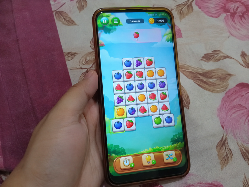 Ilustrasi game susun buah penghasil saldo DANA dengan berbagai tantangan dan hadiah koin.